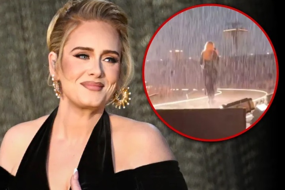 Adele performs Munich tour date in torrential downpour !